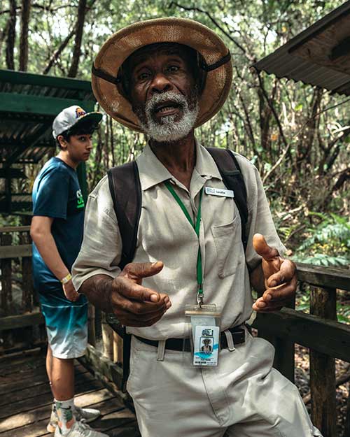 Tour guide addressing audience outdoors